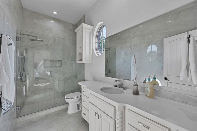 bathroom with vanity, toilet, and walk in shower