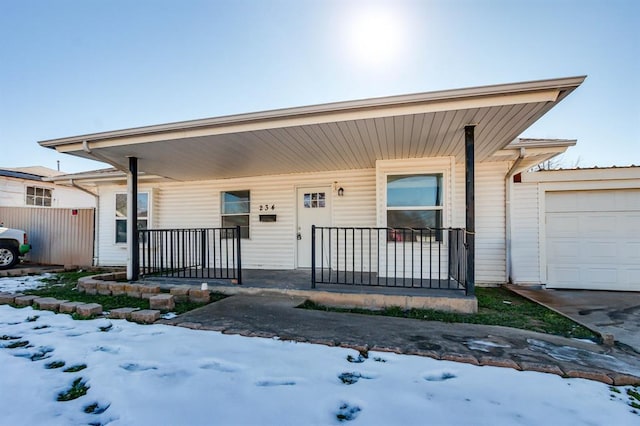 view of front facade with a garage and a porch