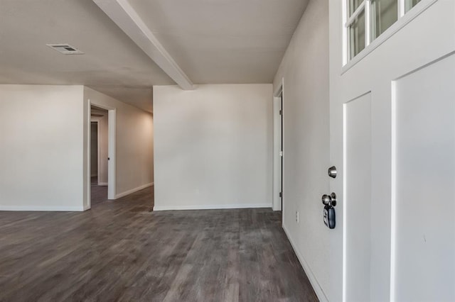 interior space featuring dark hardwood / wood-style floors and beamed ceiling