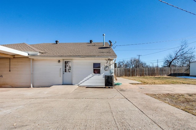 rear view of house with a patio and central air condition unit