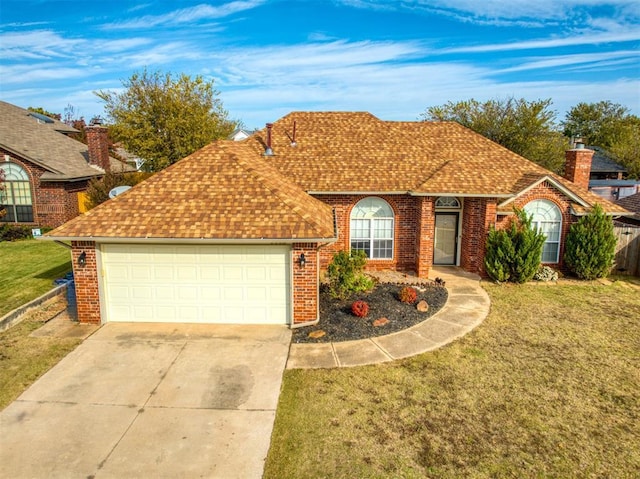 single story home featuring a front lawn and a garage