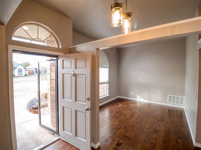 entryway with dark hardwood / wood-style floors