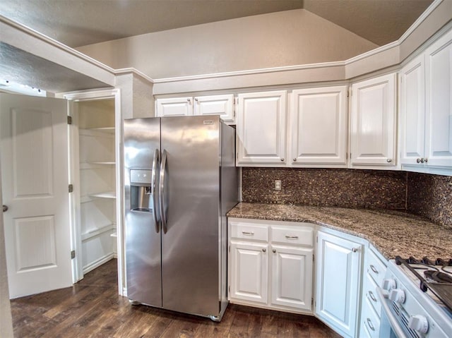 kitchen featuring white cabinetry, lofted ceiling, stone countertops, backsplash, and stainless steel refrigerator with ice dispenser