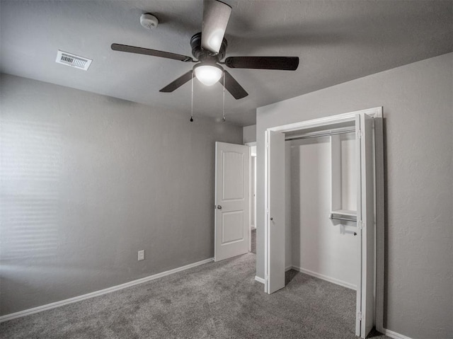 unfurnished bedroom with ceiling fan and carpet floors