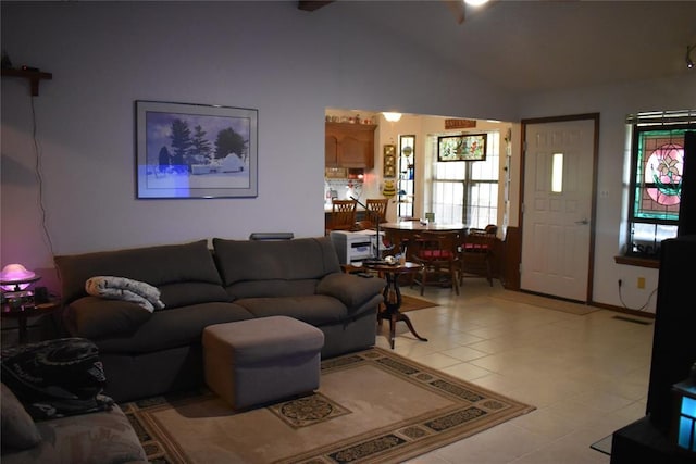 tiled living room featuring lofted ceiling