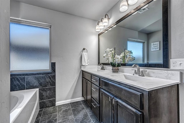 bathroom with a bathing tub and vanity