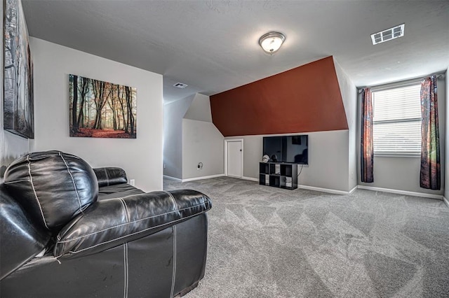 home theater featuring carpet and lofted ceiling