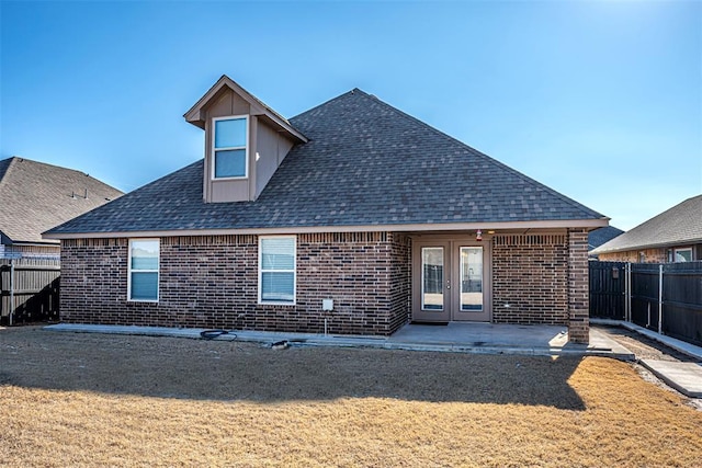 back of property with a patio