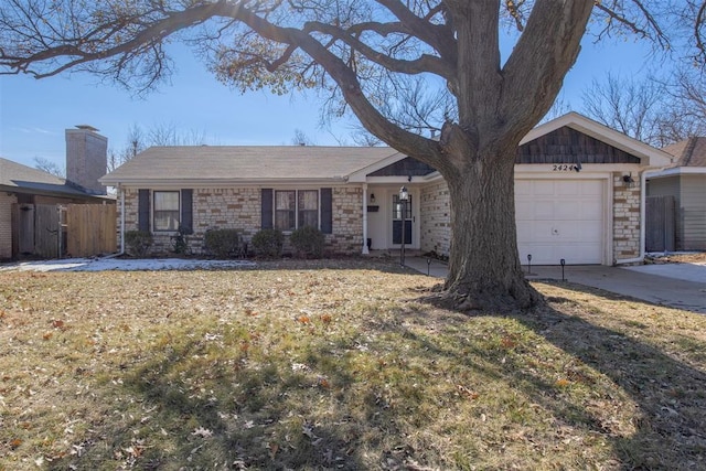 single story home with a front lawn and a garage