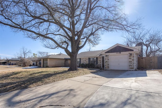 ranch-style home featuring a garage