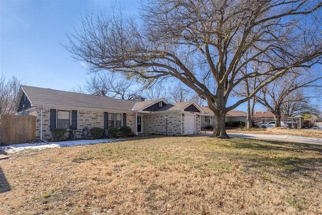 ranch-style house with a front lawn and a garage