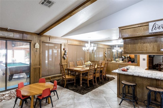 tiled dining room with vaulted ceiling with beams, a notable chandelier, and wooden walls