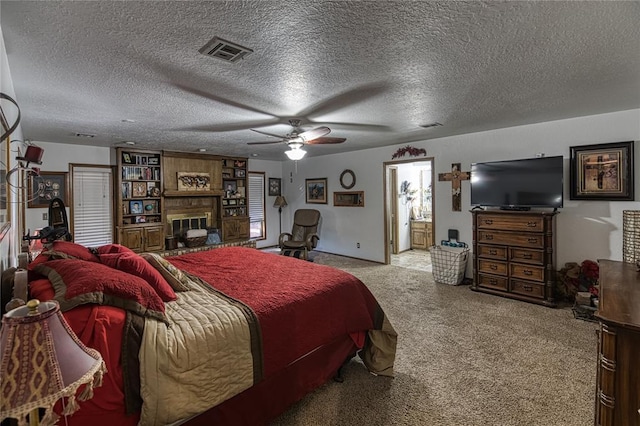 carpeted bedroom featuring a textured ceiling