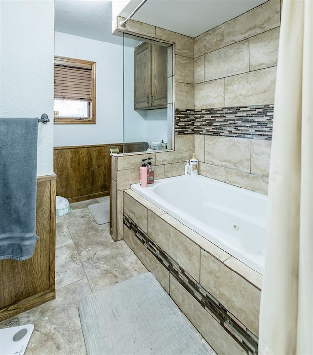 bathroom with tiled tub