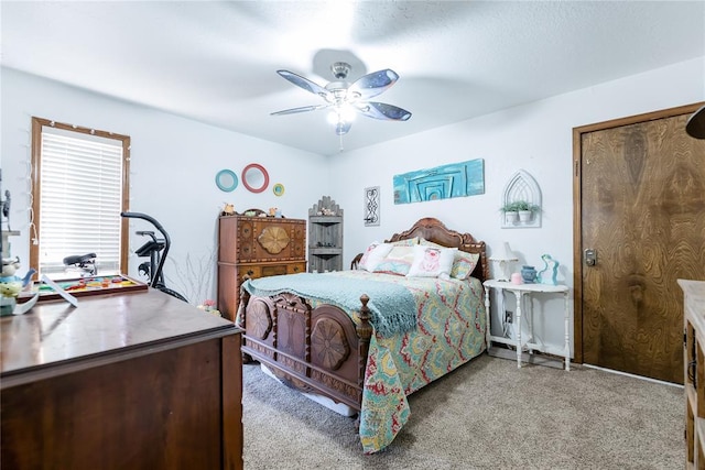 bedroom with ceiling fan and carpet floors