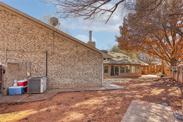 back of property featuring a patio area and central air condition unit