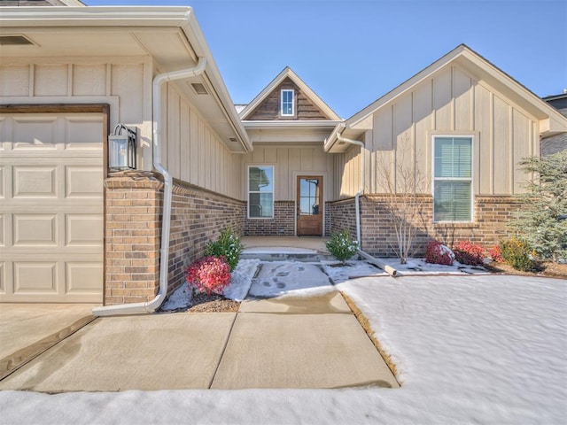 view of exterior entry with a garage