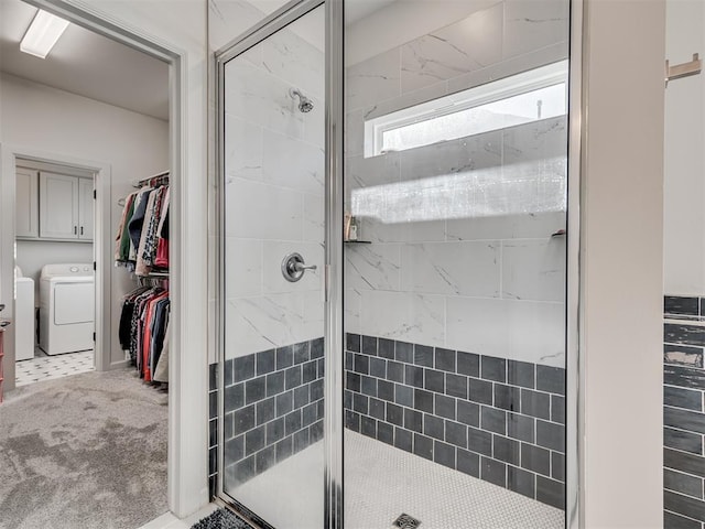 bathroom featuring a shower with door