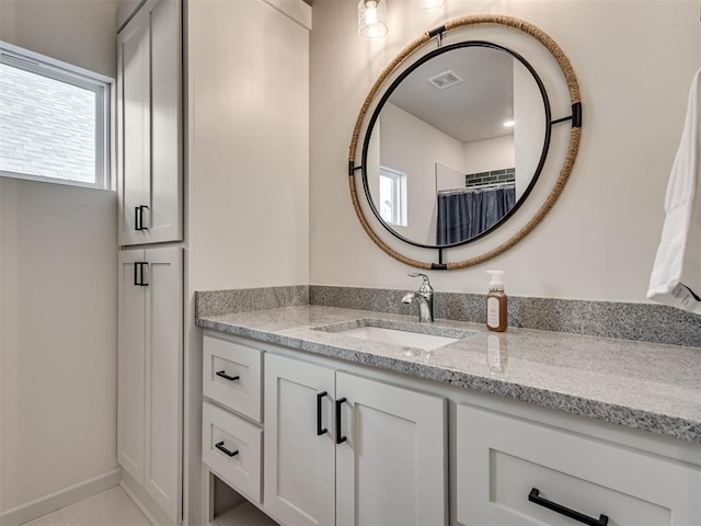 bathroom with vanity and walk in shower