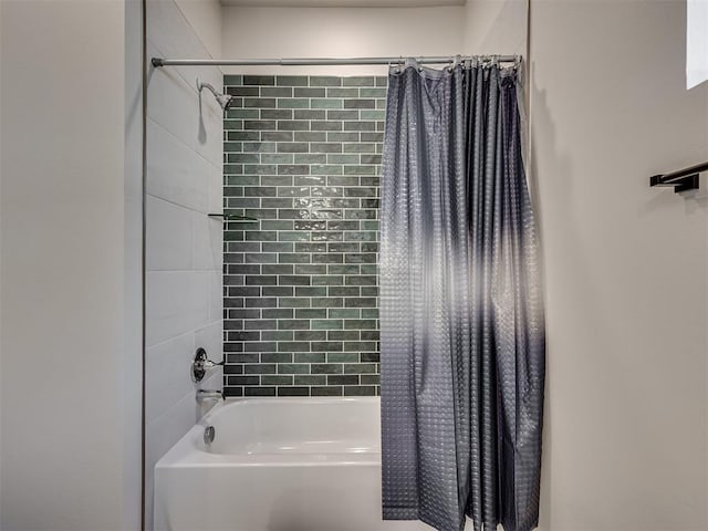 bathroom with shower / bathtub combination with curtain