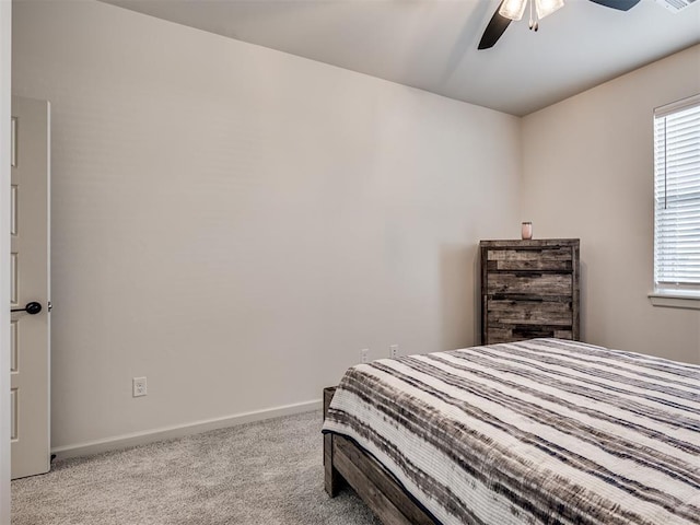 bedroom featuring ceiling fan and light carpet