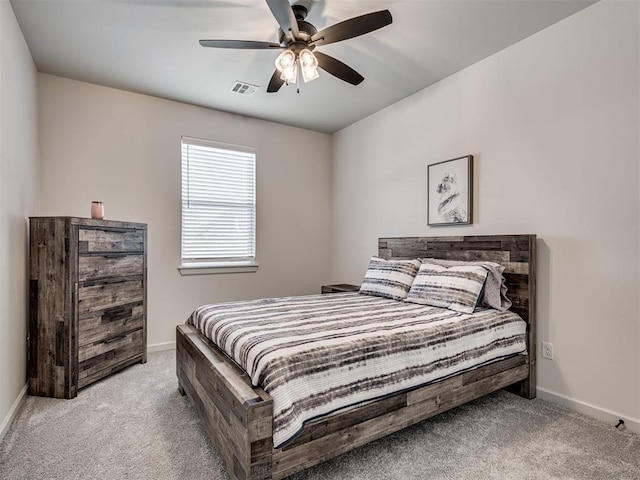 bedroom with ceiling fan and light carpet