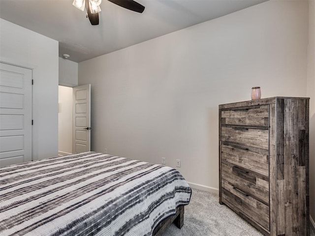 bedroom with light colored carpet and ceiling fan