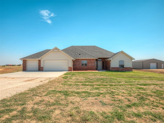 ranch-style house with a garage and a front lawn