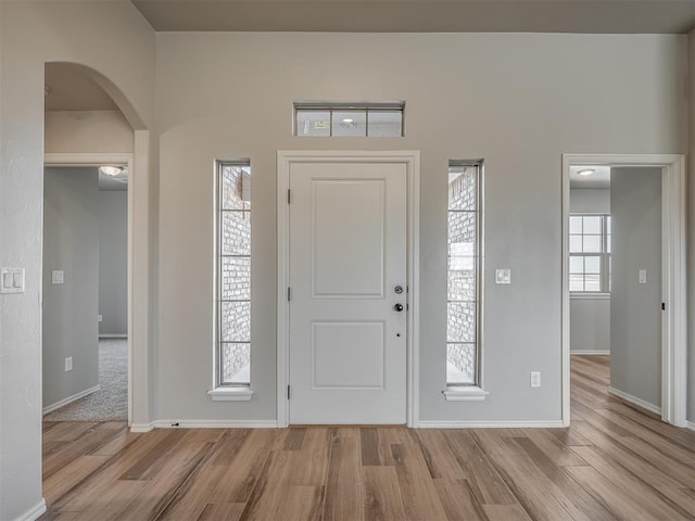 entryway with light hardwood / wood-style floors