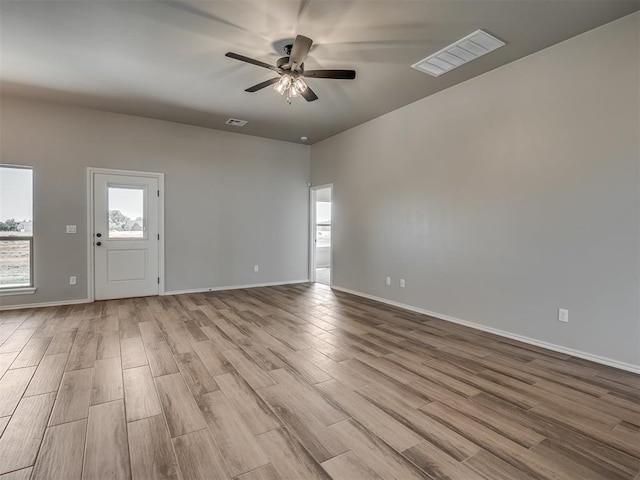 unfurnished room featuring light hardwood / wood-style flooring and ceiling fan