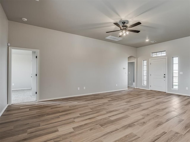 entrance foyer with ceiling fan and light hardwood / wood-style floors