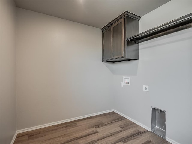 laundry room featuring cabinets, washer hookup, light wood-type flooring, and hookup for an electric dryer