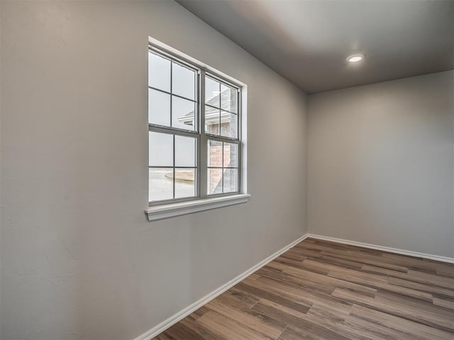 spare room featuring hardwood / wood-style flooring