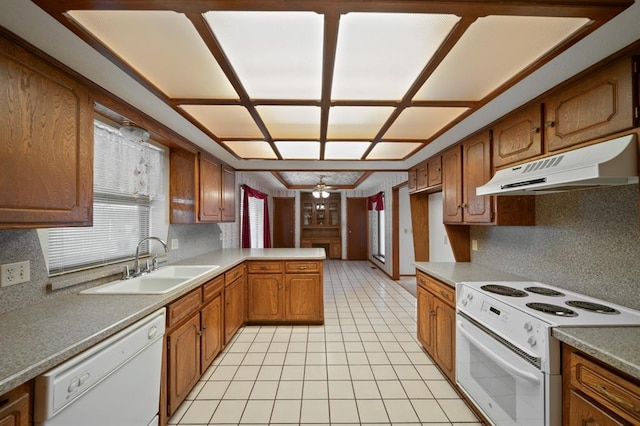 kitchen with white appliances, ceiling fan, plenty of natural light, and sink