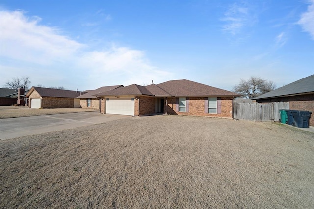 ranch-style house featuring a front lawn and a garage