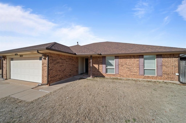 ranch-style house featuring a garage