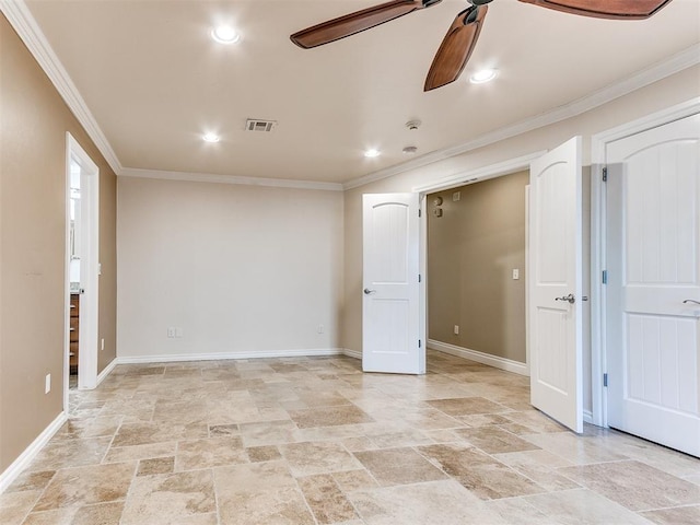 spare room featuring ceiling fan and crown molding