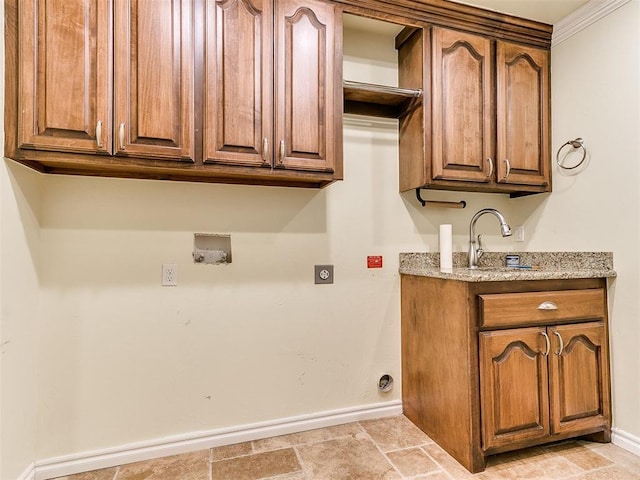 laundry area featuring cabinets, hookup for a washing machine, hookup for an electric dryer, ornamental molding, and sink