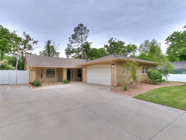 6704 Tall Oaks Dr, Oklahoma City, OK 73127 - single story home with driveway, a garage, fence, and brick siding