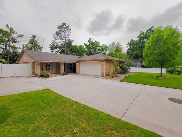 6704 Tall Oaks Dr, Oklahoma City, OK 73127 - ranch-style home with brick siding, concrete driveway, and an attached garage