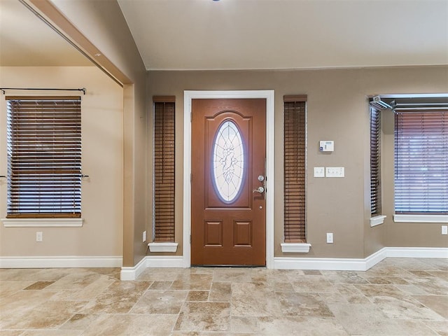 6704 Tall Oaks Dr, Oklahoma City, OK 73127 - foyer with light stone finish floors and baseboards