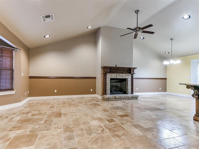6704 Tall Oaks Dr, Oklahoma City, OK 73127 - unfurnished living room featuring stone tile floors, a ceiling fan, a fireplace with raised hearth, baseboards, and high vaulted ceiling