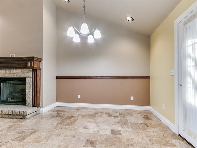 6704 Tall Oaks Dr, Oklahoma City, OK 73127 - unfurnished living room featuring stone tile floors, a chandelier, baseboards, a stone fireplace, and high vaulted ceiling