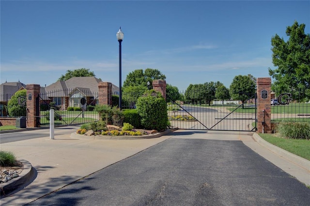 view of gate with fence
