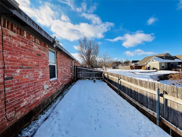 view of yard layered in snow