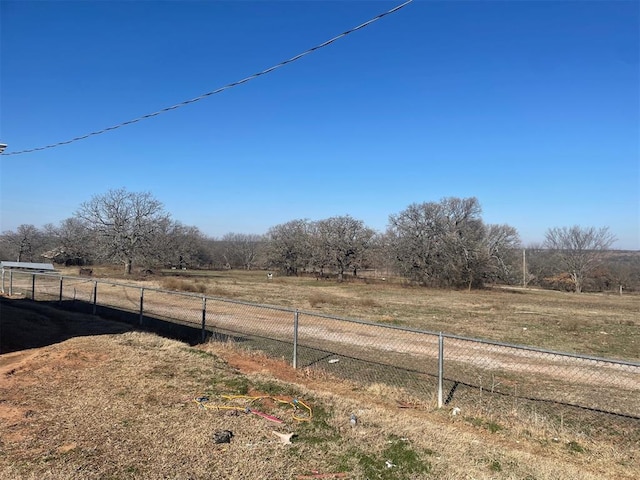 view of yard with a rural view