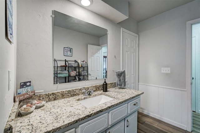 bathroom featuring vanity and wood-type flooring