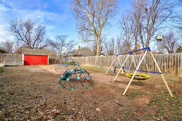 view of jungle gym with a storage shed