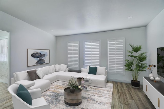 living room featuring hardwood / wood-style floors and a healthy amount of sunlight