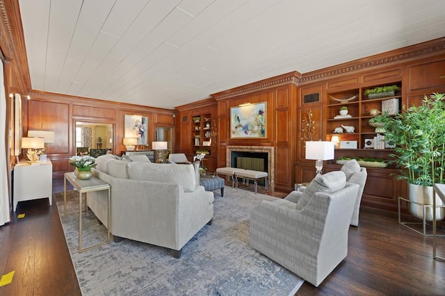 living room featuring built in features and dark wood-type flooring